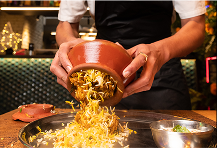 Biryani being poured onto a plate